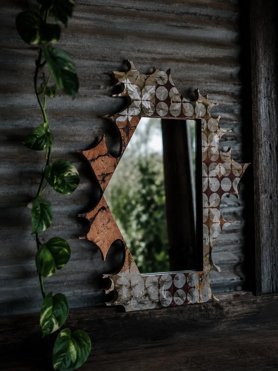 Hexagonal mirror on corrugated iron